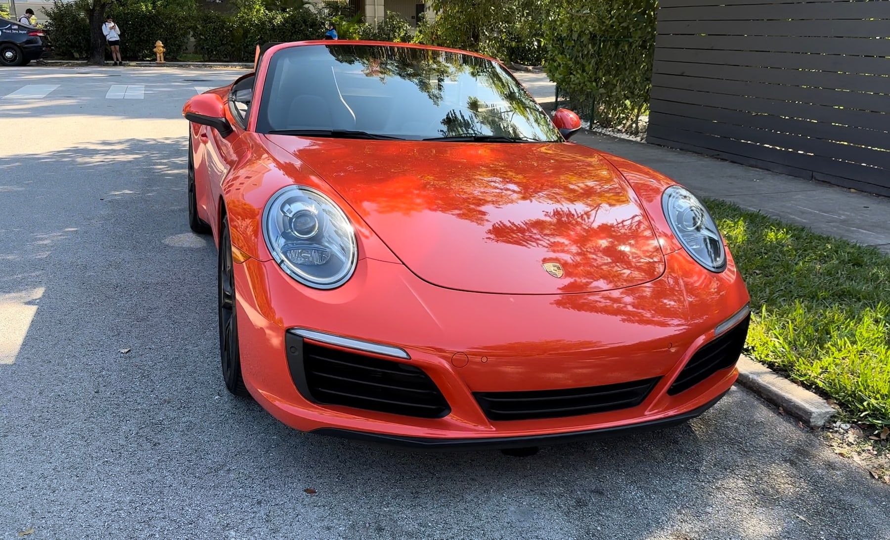 The Porsche with its front bumper repaired and repainted
