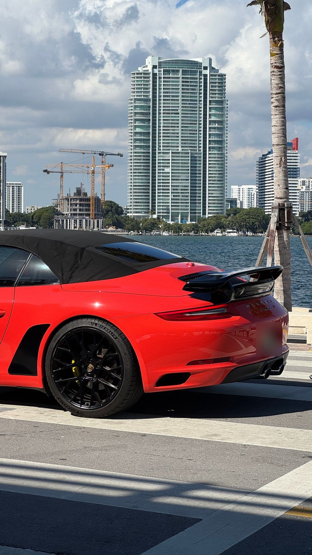 The rear of the Porsche with its black rear spoiler
